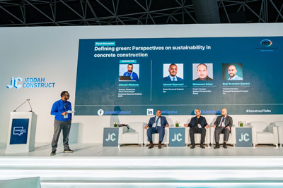 panel of men sitting on stage